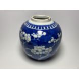 AN EARLY 20TH CENTURY CHINESE BLUE AND WHITE PRUNUS PATTERN GINGER JAR, DOUBLE RING MARK TO BASE,
