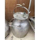 A STAINLESS STEEL MILKING BUCKET WITH LID