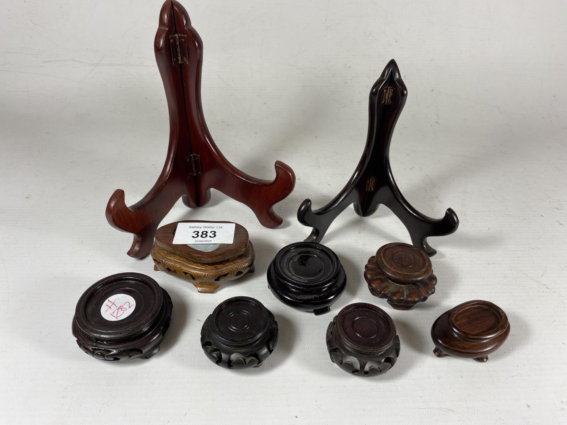 A GROUP OF ORIENTAL MINIATURE CARVED WOODEN VASE STANDS