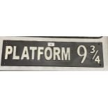 A CAST 'PLATFORM 9 3/4' HARRY POTTER RAILWAY SIGN, LENGTH 58.5CM