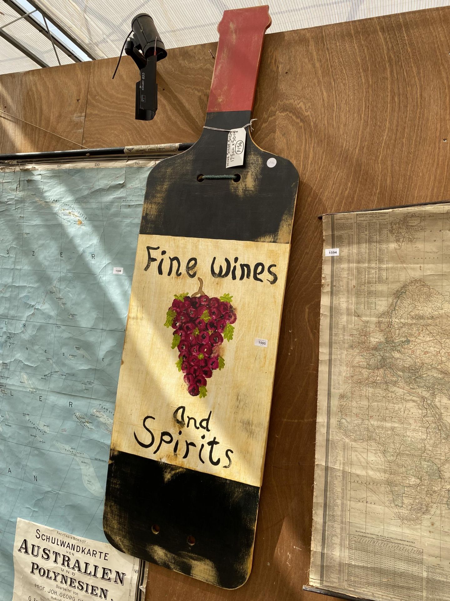 A WOODEN PAINTED WINE SHOP SIGN (175CM x 50CM)