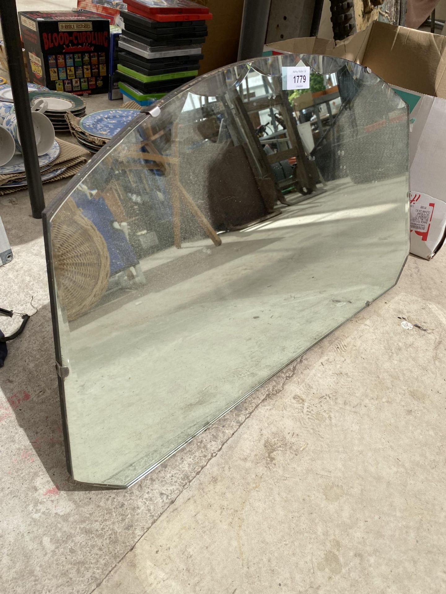 A DOMED ART DECO UNFRAMED BEVELED EDGE WALL MIRROR