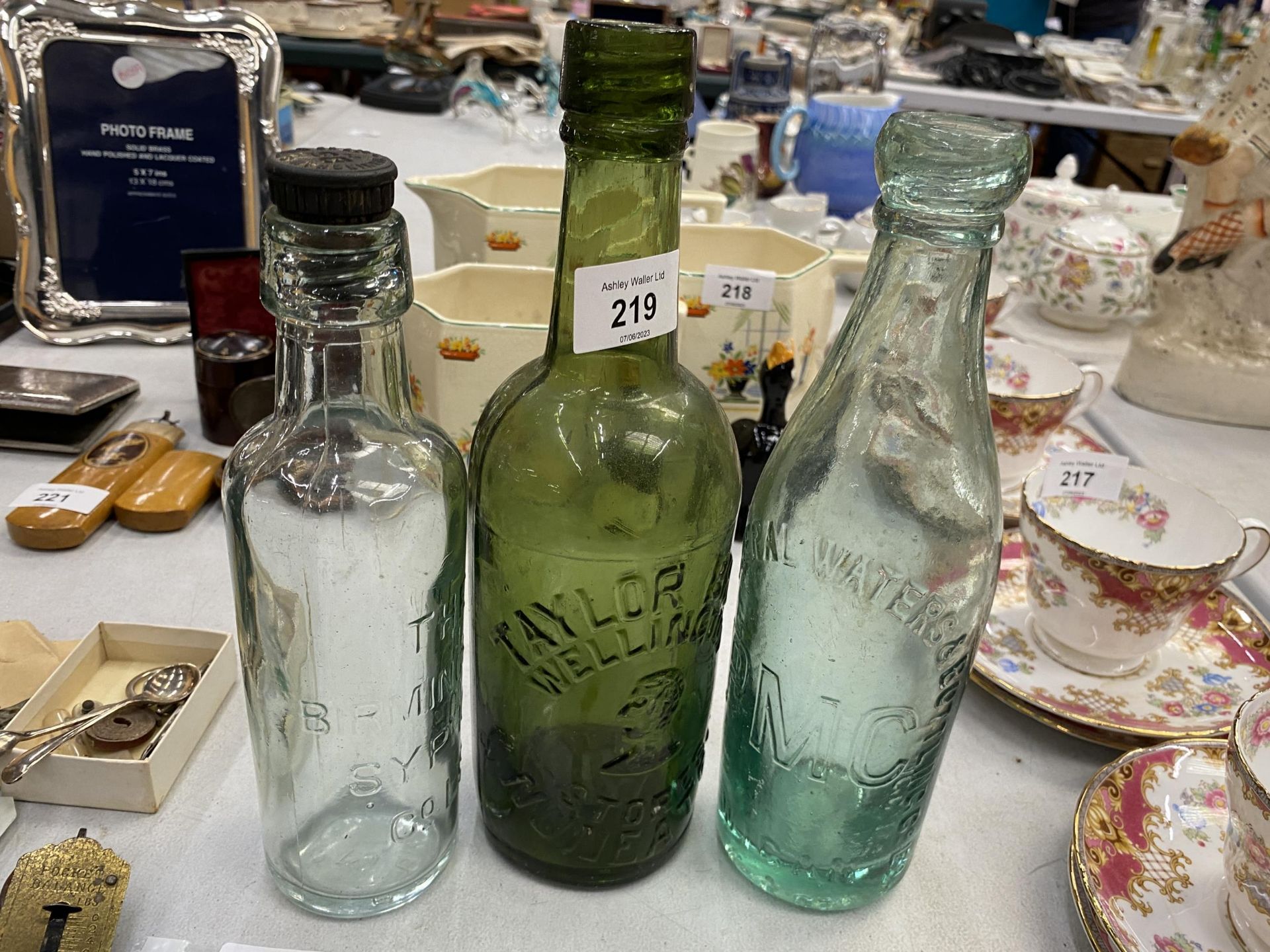 THREE VINTAGE GLASS ADVERTISING BOTTLES