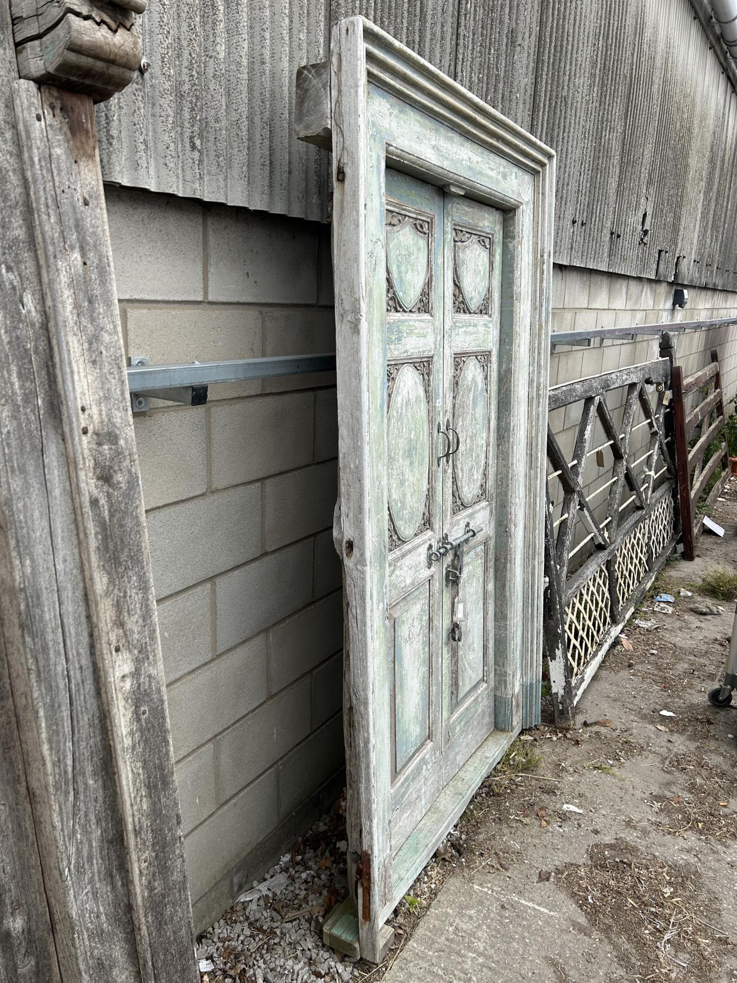 A PAIR OF INDIAN HARDWOOD PANELLED DOORS 89" x 56" TO INCLUDE FRAME WITH BRASS HASP AND HANDLES - Image 5 of 6