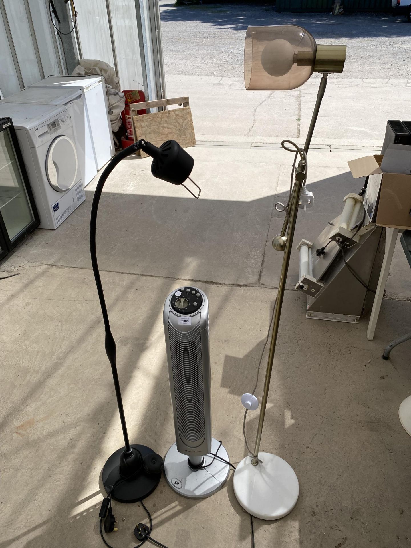 A TOWER FAN AND TWO STANDARD LAMPS