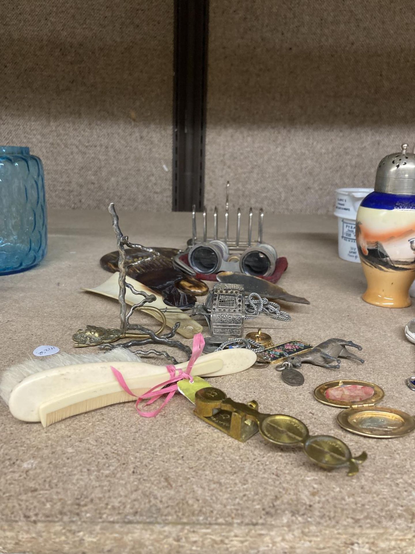 A MIXED VINTAGE LOT TO INCLUDE OPERA GLASSES, A TOAST RACK, BADGES, AN INDIAN STYLE RICKSHAW, ETC