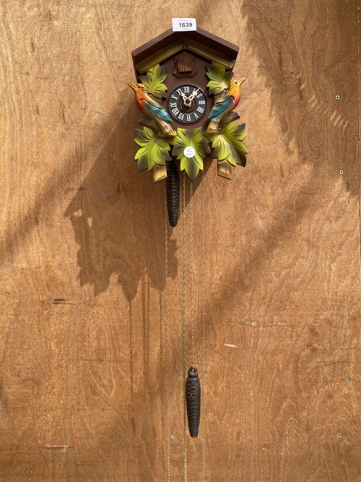 A WOODEN CUCKOO CLOCK