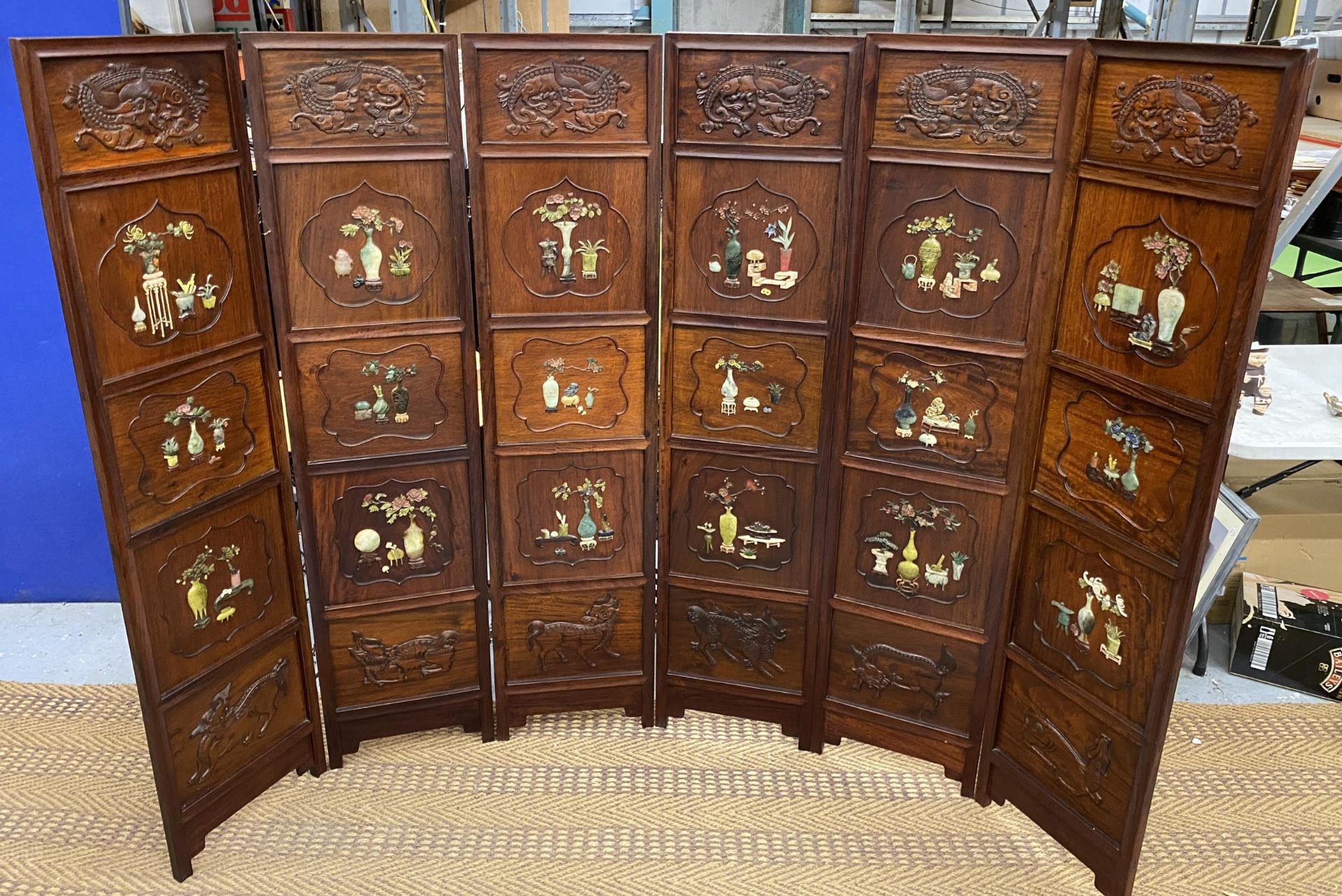 A GREAT QUALITY ORIENTAL CARVED HARDWOOD SIX SECTION SCREEN WITH EIGHTEEN SQUARE PANEL SECTIONS EACH