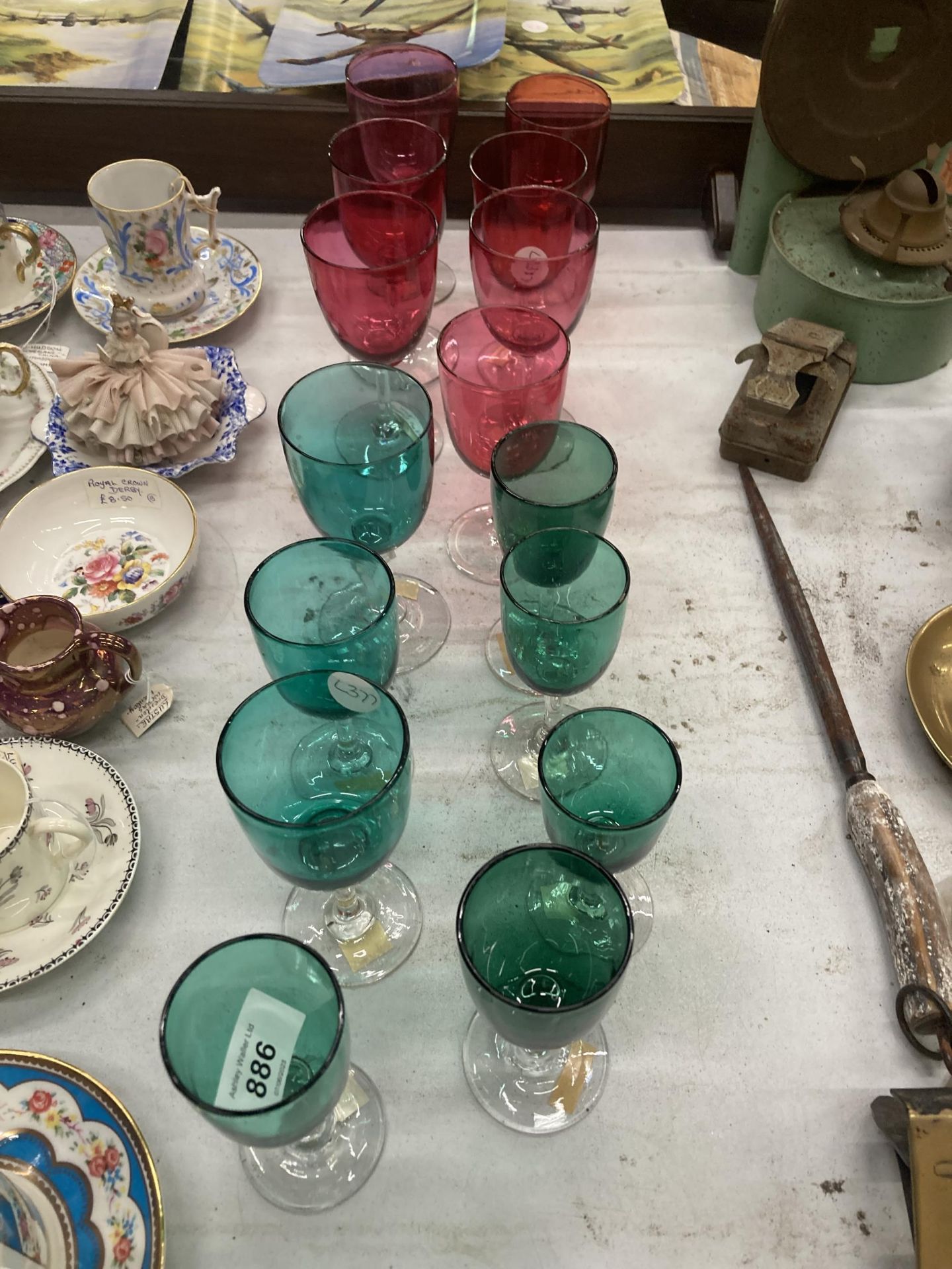 A QUANTITY OF VINTAGE GREEN AND CRANBERRY WINE GLASSES, SOME HAND BLOWN