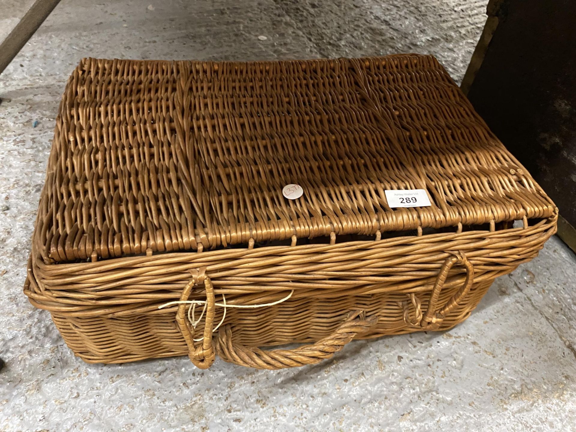 A VINTAGE WICKER PICNIC BASKET