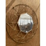 A DECORATIVE METAL FRAMED MIRROR