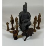 A CHINESE XIAN POTTERY WARRIOR FIGURE TOGETHER WITH FIVE CARVED ORIENTAL CHESS PIECES & A CARVED