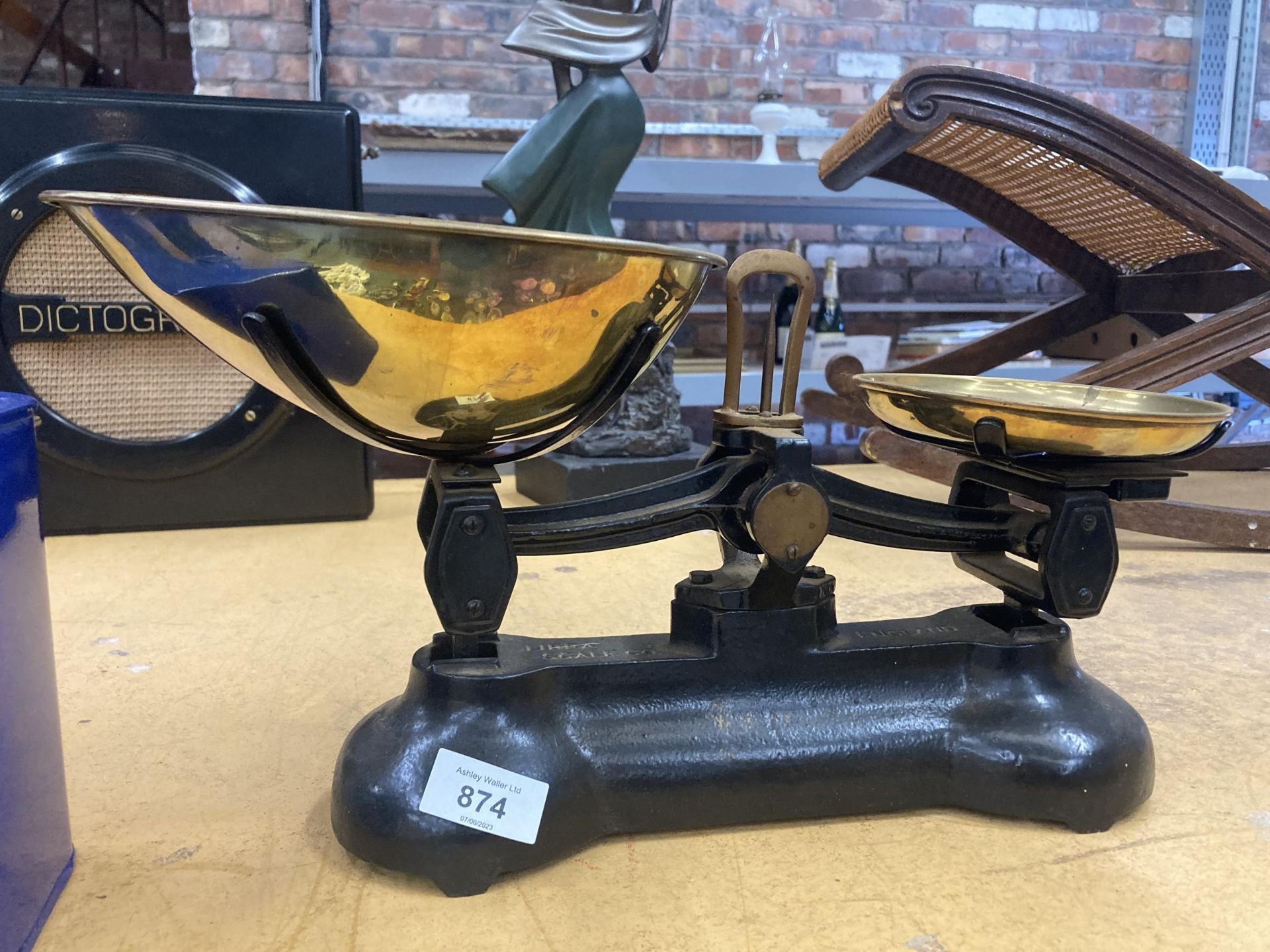 A SET OF VINTAGE CAST WEIGHING SCALES WITH BRASS PANS