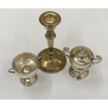A GROUP OF THREE HALLMARKED SILVER ITEMS COMPRISING A WEIGHTED CANDLESTICK, LIGHTER AND TWIN HANDLED