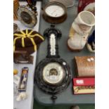 AN EBONY FRAMED VINTAGE BAROMETER AND THERMOMETER PLUS A ROUND METAL BAROMETER