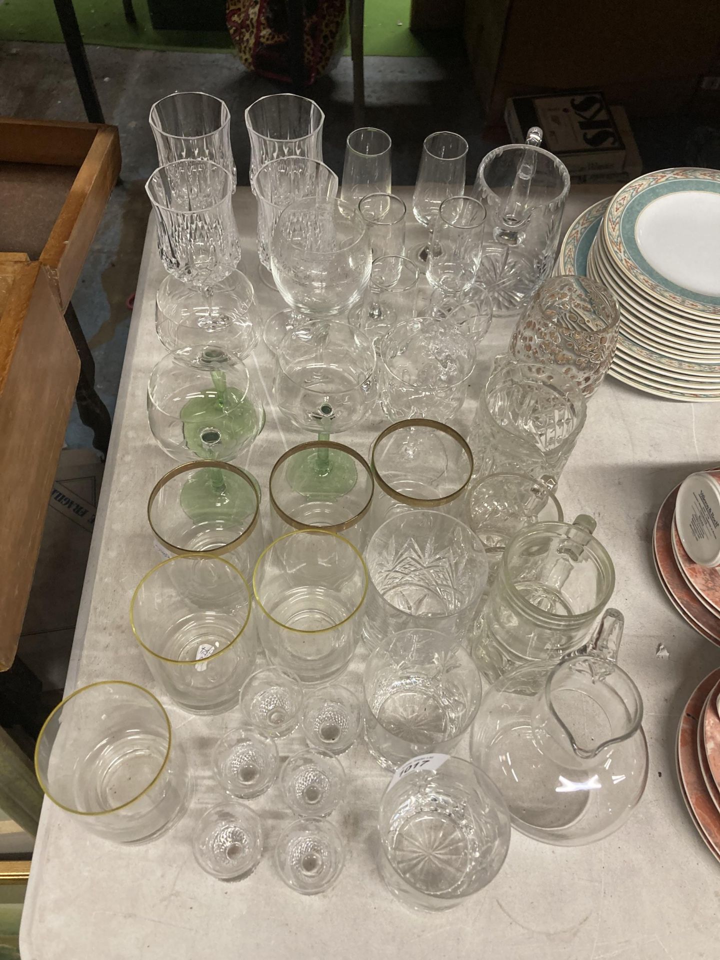 A LARGE QUANTITY OF GLASSES TO INCLUDE WINE, SHERRY, TUMBLERS, JUGS, ETC