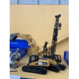 TWO LARGE JAPANESE HUINA TOYS - A CRANE AND A DIGGER