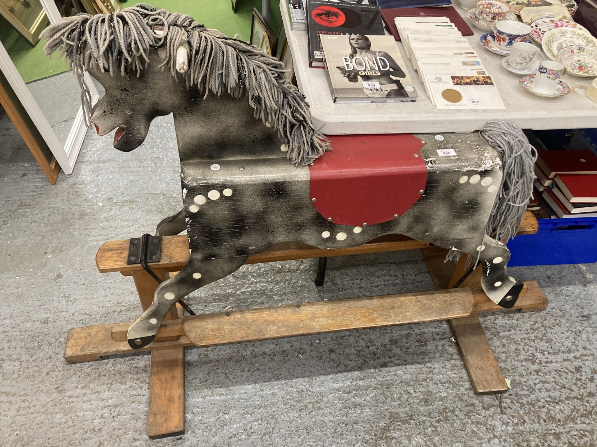 A VINTAGE CHILD'S WOODEN ROCKING HORSE HEIGHT TO THE SEAT 69CM, LENGTH 150CM