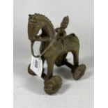 AN UNUSUAL 19TH CENTURY INDIAN METAL TEMPLE TOY MODEL OF A HORSE AND RIDER, HEIGHT 12CM