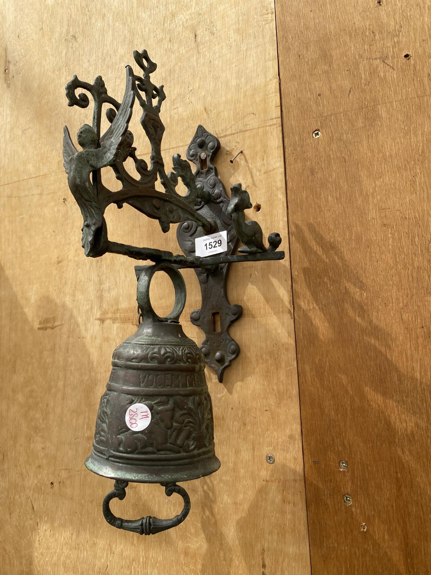 A VINTAGE BRASS WALL HANGING BELL