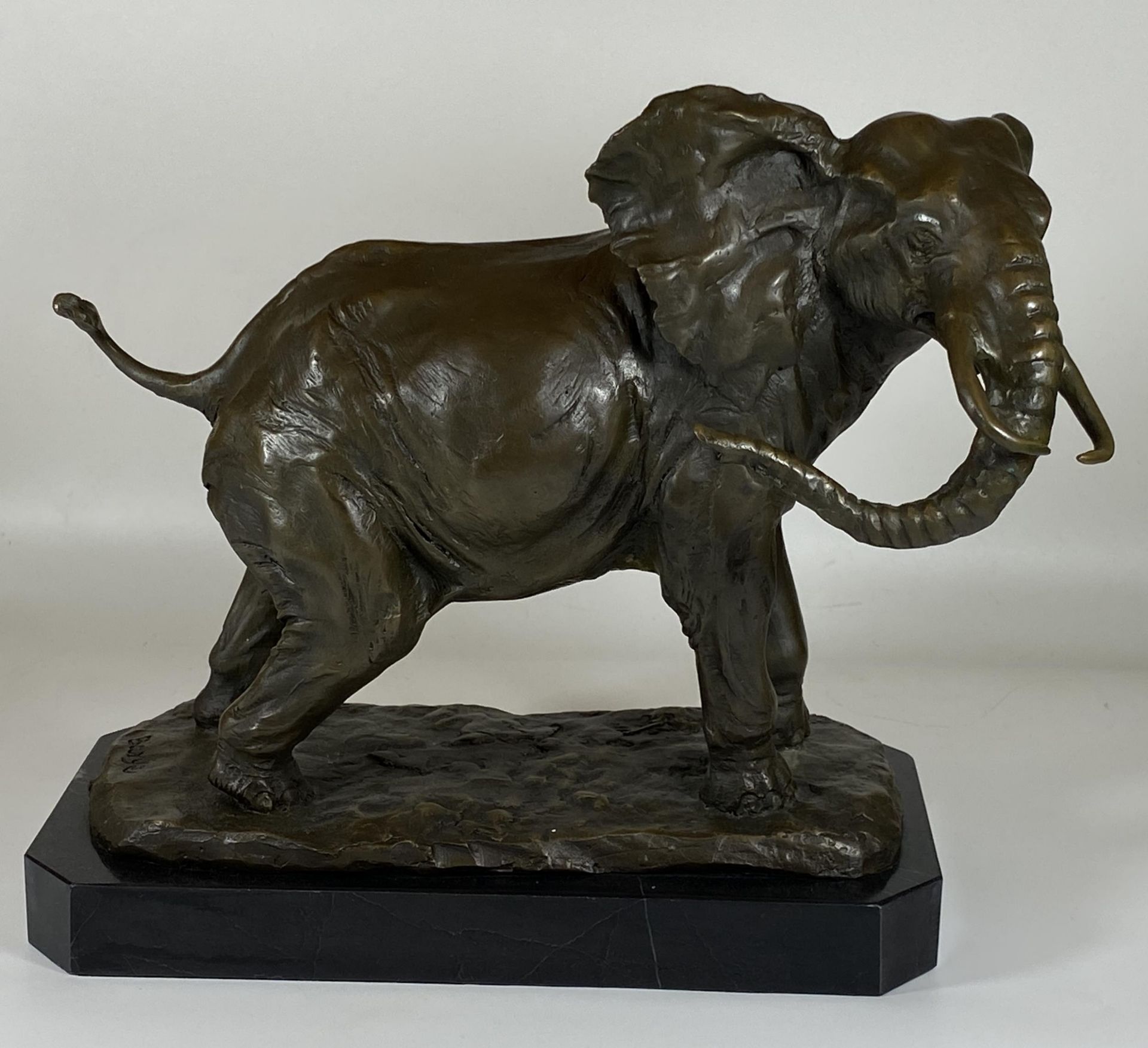 A LARGE BRONZE MODEL OF AN AFRICAN ELEPHANT ON MARBLE BASE, SIGNED BARYE, HEIGHT 29CM, LENGTH 29CM