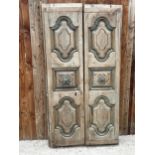 A PAIR OF INDIAN HARDWOOD PANELLED DOORS WITH BRASS HANDLES (ONE PIECE MISSING) 77 X 41"