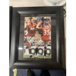 A FRAMED SIGNED PHOTO OF CHRIS SMALLING AND CLEVERLEY