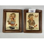 A PAIR OF SMALL HUMMEL POTTERY FIGURAL PLAQUES