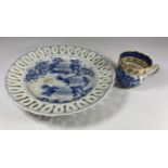 A 19TH CENTURY JAPANESE BLUE AND WHITE PIERCED RIM PLATE TOGETHER WITH A CHINESE 19TH CENTURY EXPORT