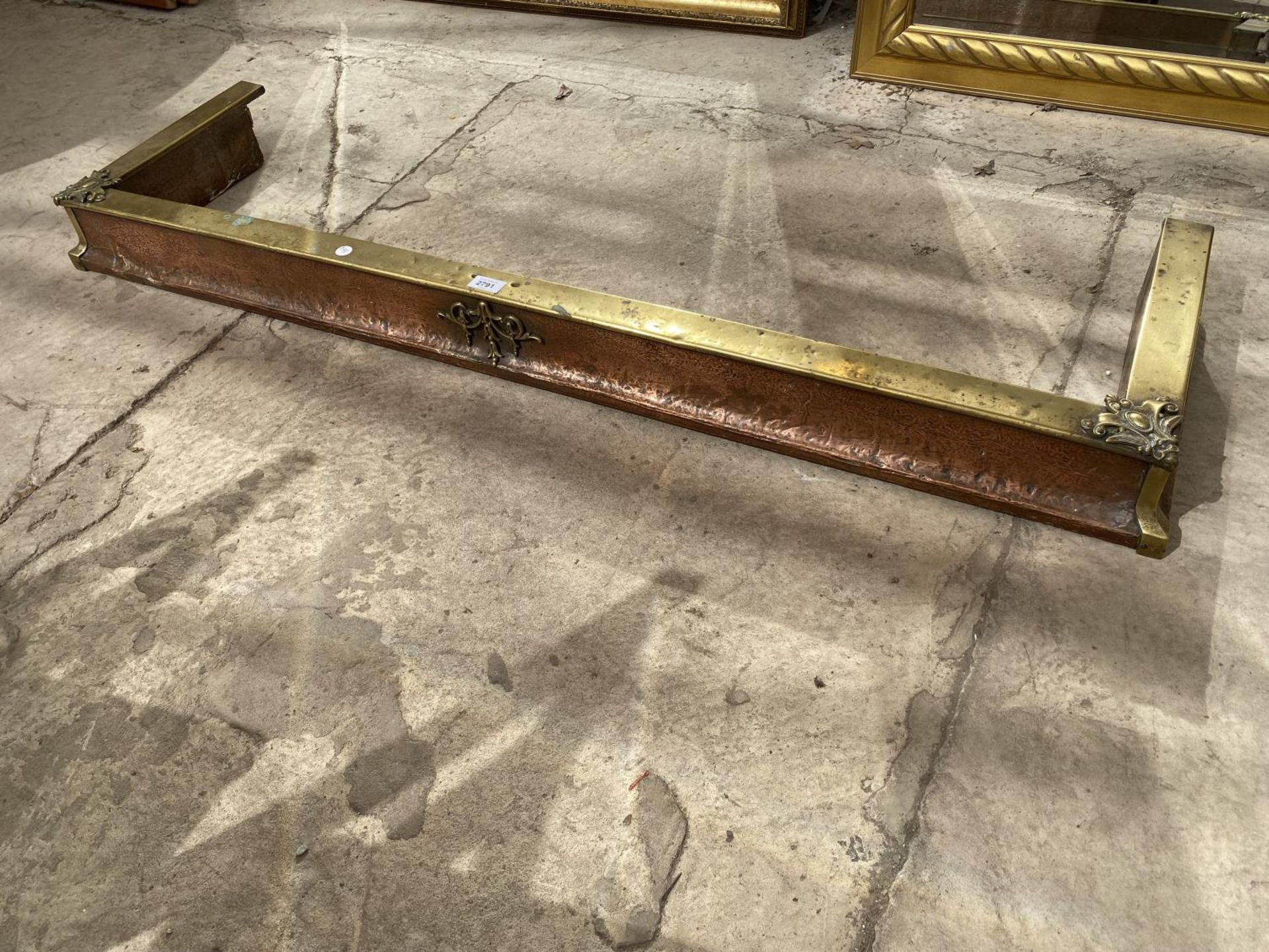 A VICTORIAN BRASS AND COPPER FIRE KERB