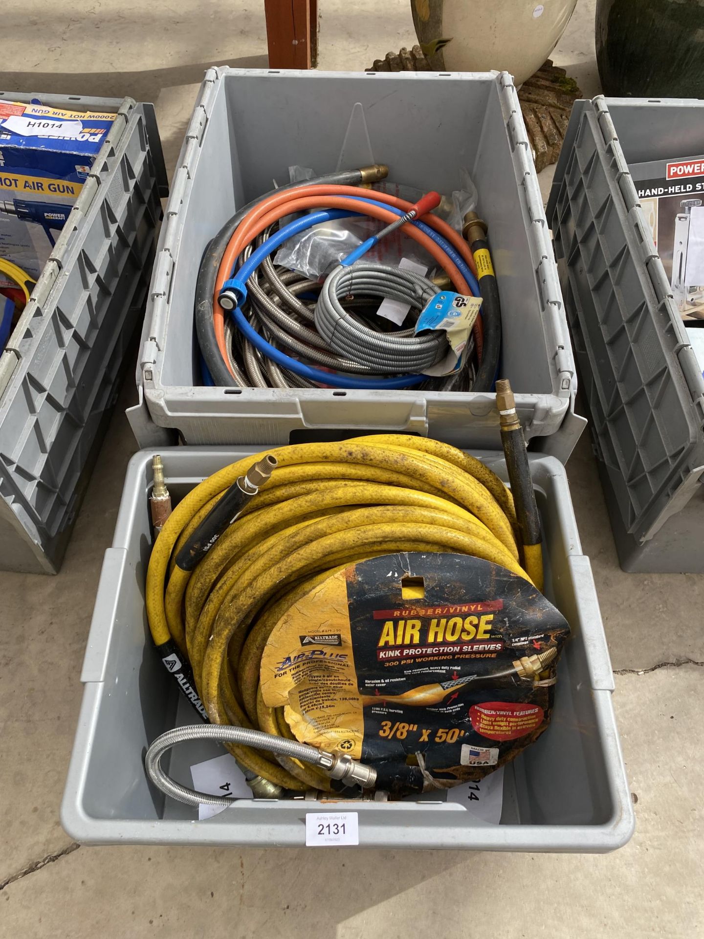 AN ASSORTMENT OF ITEMS TO INCLUDE AN AIR HOSE ETC