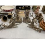 A PAIR OF HEAVY WHITE METAL STAG ORNAMENTS AND A PAIR OF PLATED CANDLESTICKS