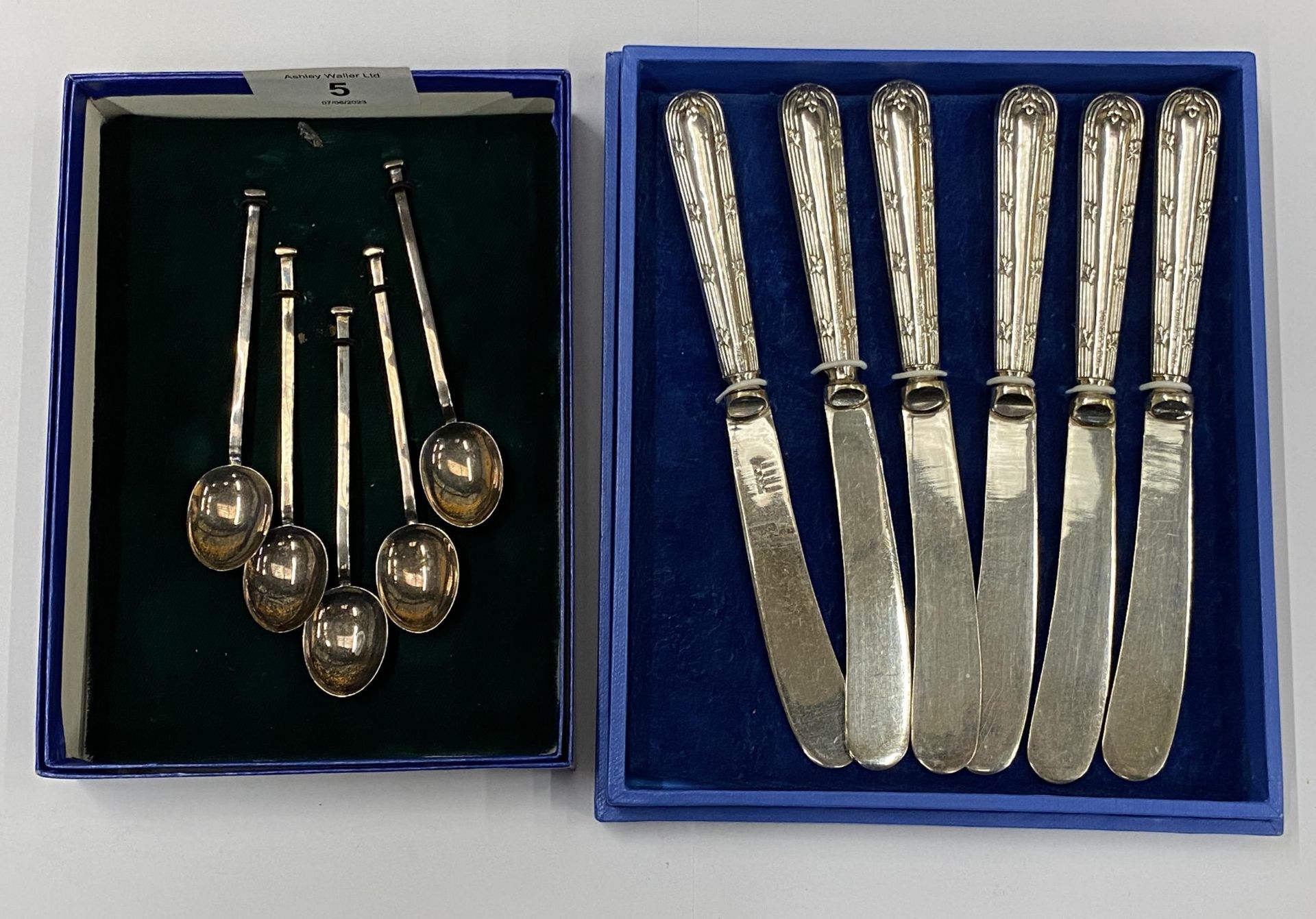 TWO BOXED SILVER ITEMS - FIVE COFFEE SPOONS AND SIX HALLMARKED SILVER HANDLED BUTTER KNIVES