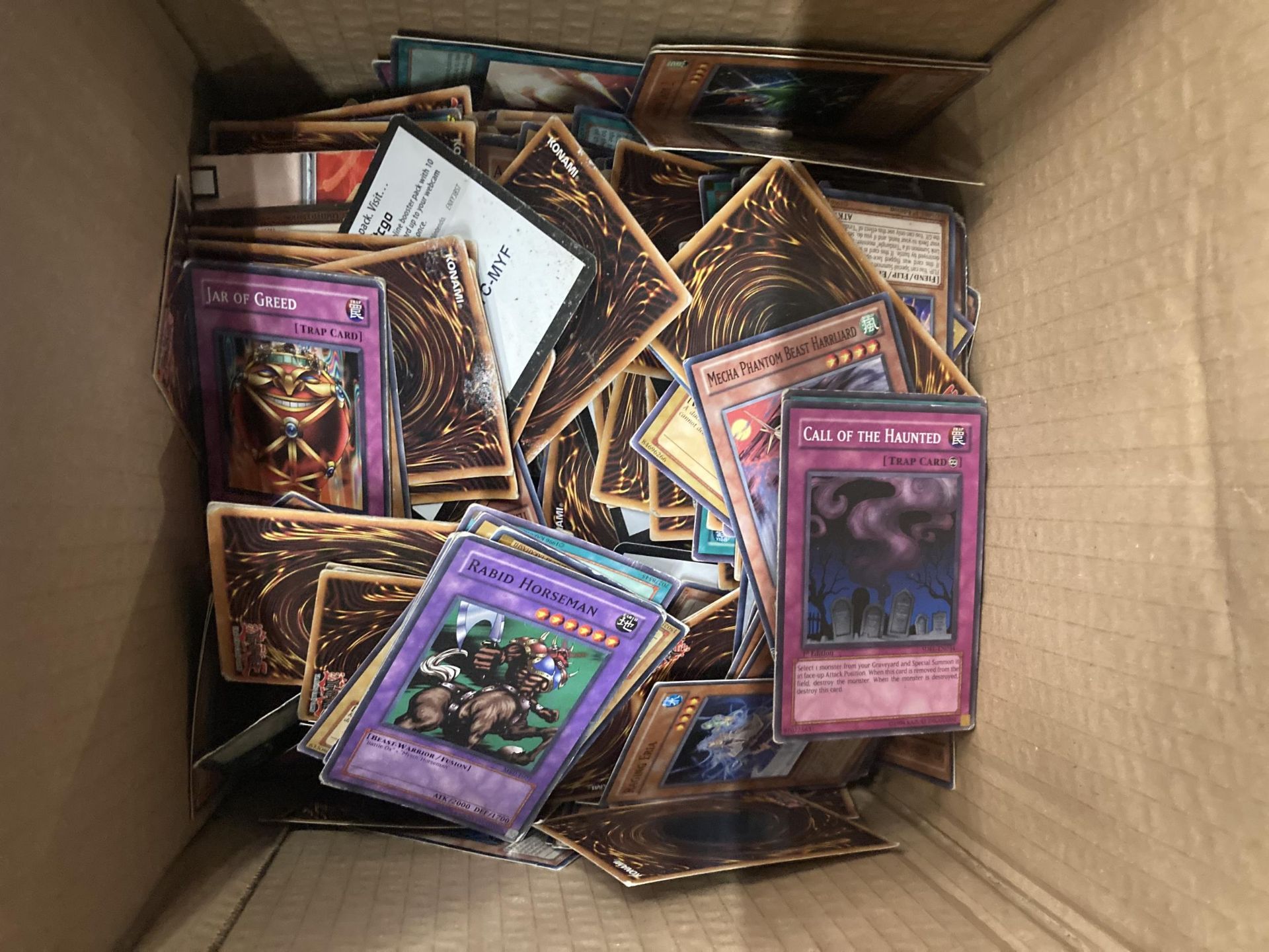 A BOX OF ASSORTED YU-GI-OH CARDS