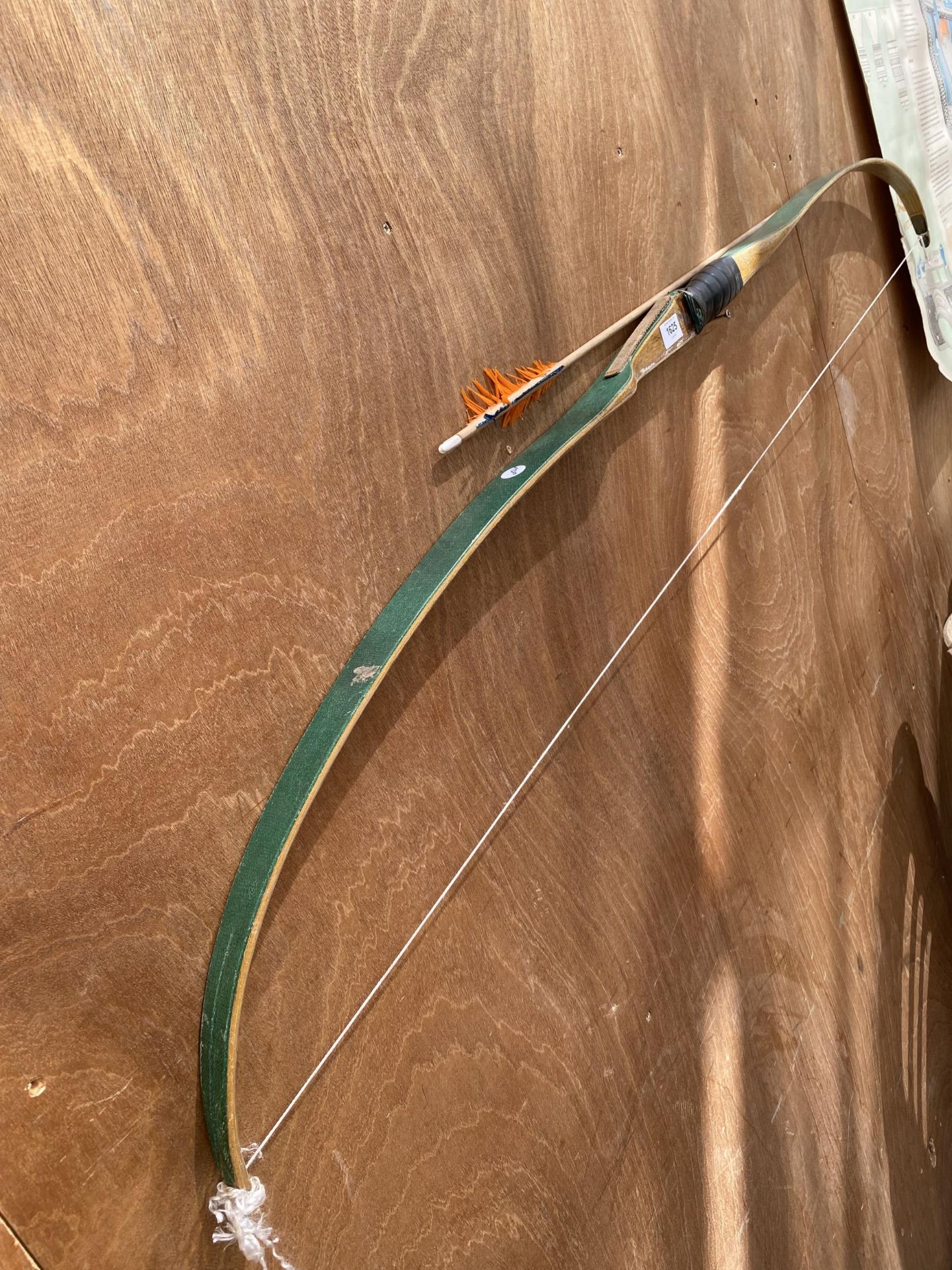 A VINTAGE WOODEN BOW AND ARROW