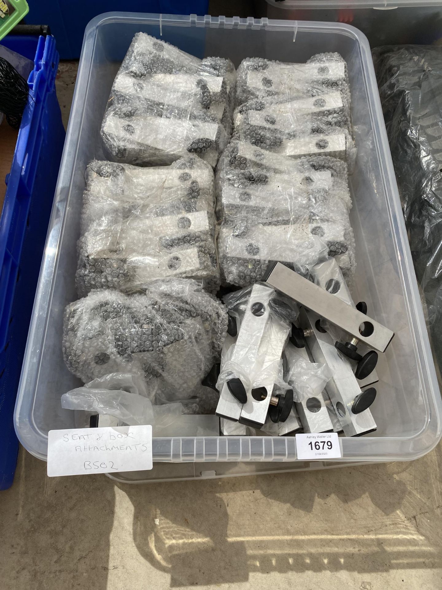 A BOX CONTAINING A LARGE QUANTITY OF SEAT OR BOX ATTATCHMENT BRACKETS (FROM A TACKLE SHOP CLEARANCE)