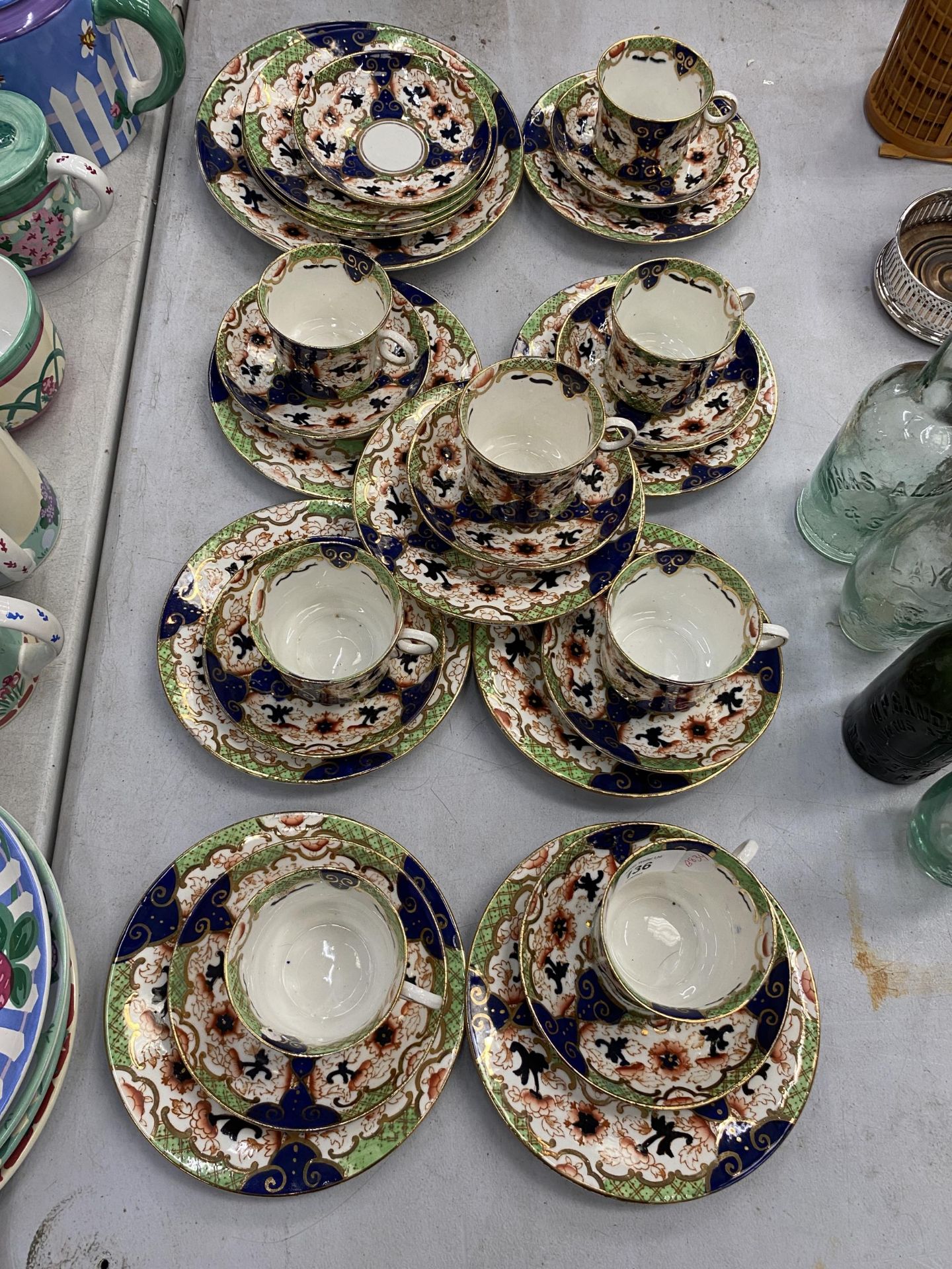 A COLLECTION OF VINTAGE ROYAL STAFFORD CUPS, SAUCERS AND SIDE PLATES