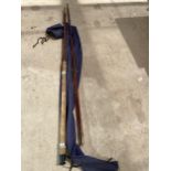 A THREE SECTION FIBRE GLASS AND BRASS COURSE FLOAT FISHING ROD