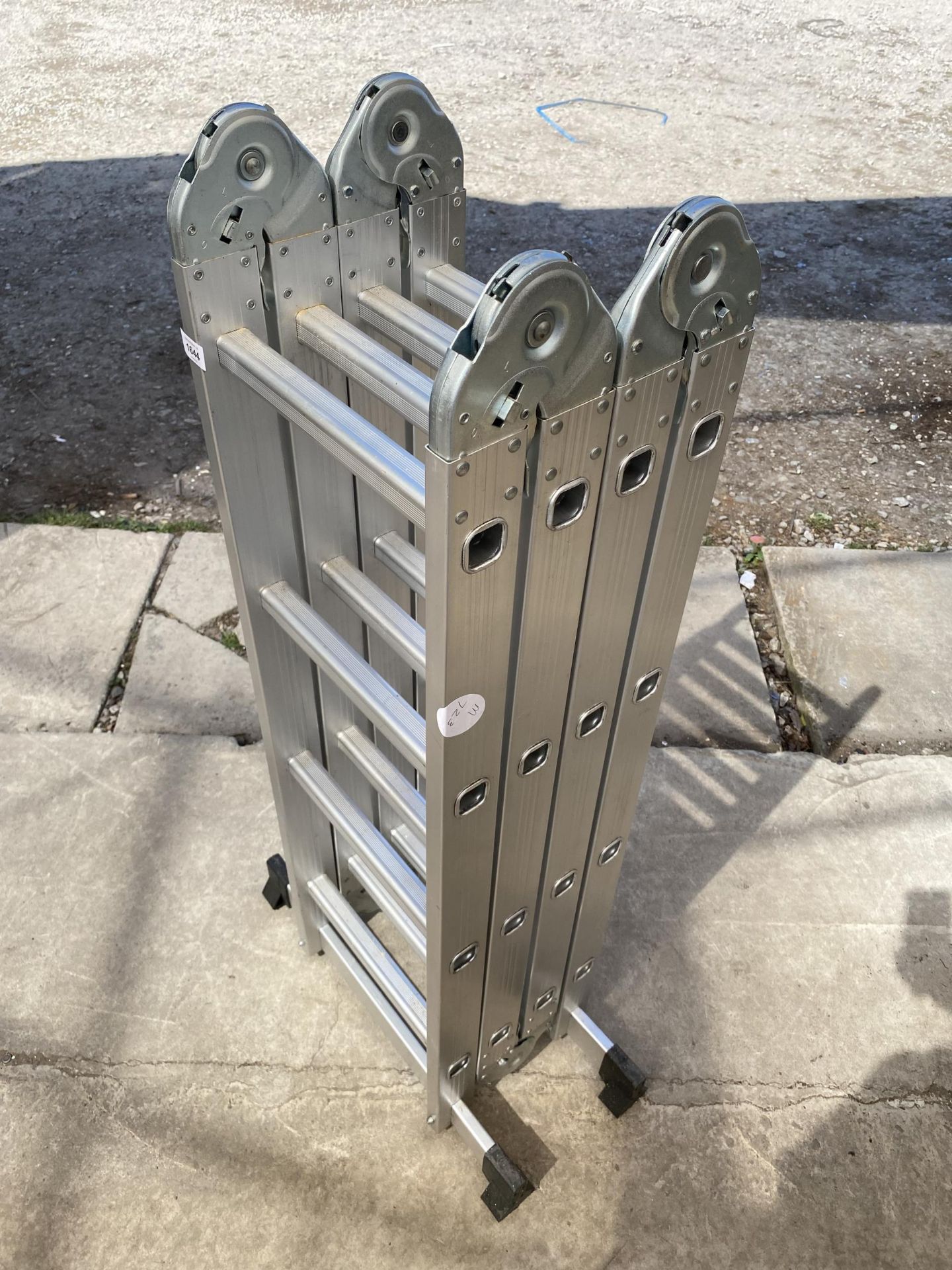 A FOUR SECTION MULTIFUNCTIONAL ALUMINIUM LADDER