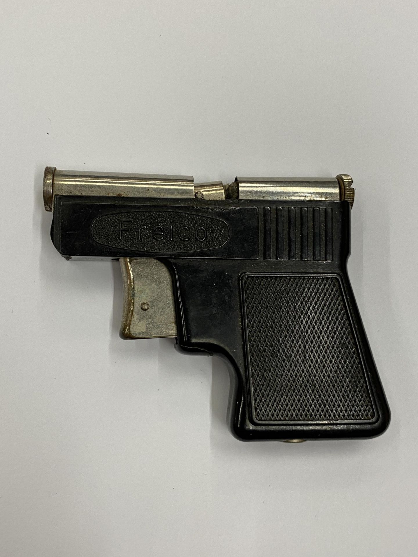 A FREICO PISTOL CIGARETTE LIGHTER