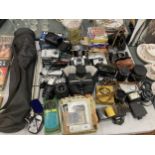 A LARGE QUANTITY OF CAMERAS AND ACCESSORIES TO INCLUDE A CANON EOS 500, HALINA PAULETTE, OLYMPUS C-