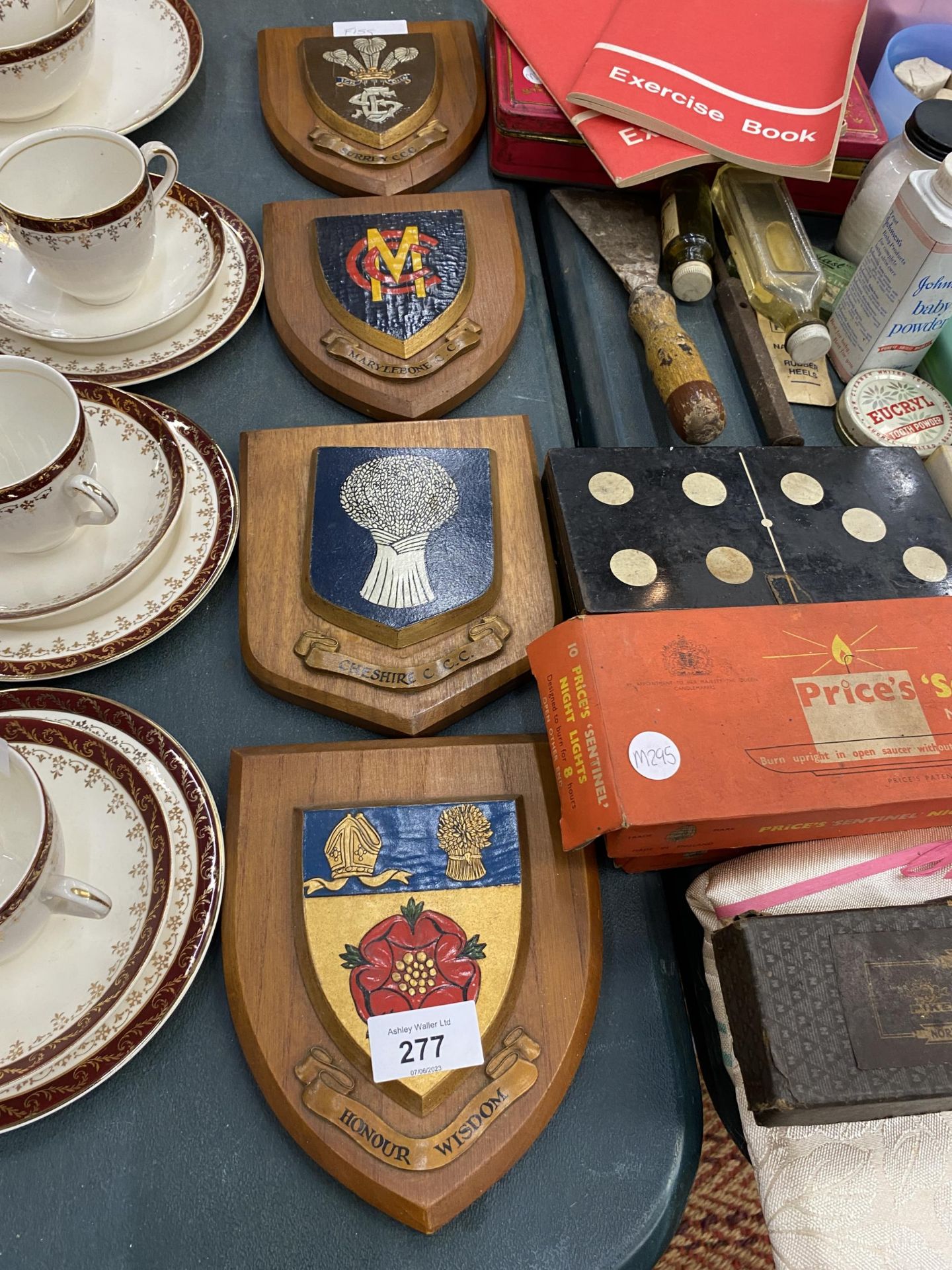 FOUR SHIELDS ON WOODEN PLAQUES TO INCLUDE CHESHIRE CCC, MARYLEBONE CCC, ETC