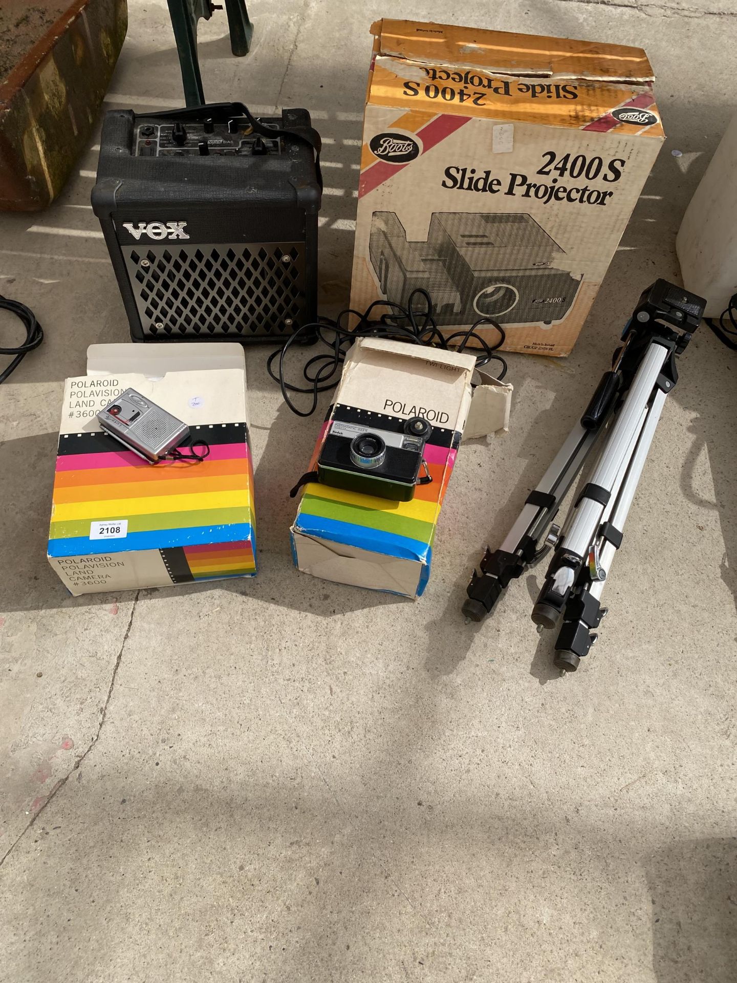 AN ASSORTMENT OF ITEMS TO INCLUDE CAMERAS, A TRIPOD STAND AND AVEX AMPLIFIER ETC