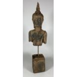 A DECORATIVE STONE BUDDHA ON METAL POLE AND SQUARE BASE, HEIGHT 39CM