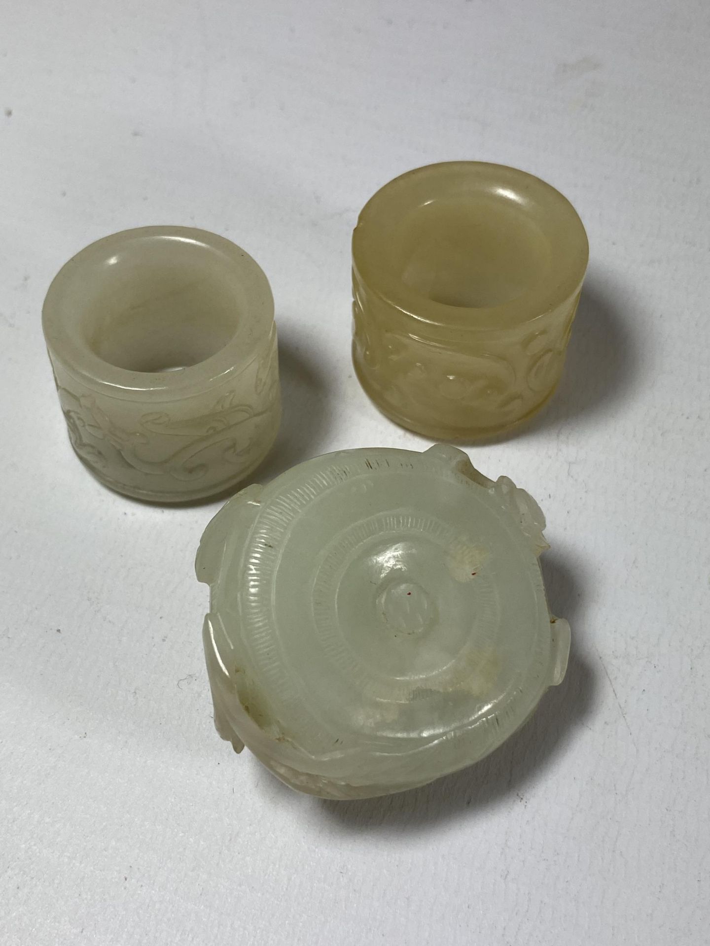 A GROUP OF THREE CHINESE JADE TYPE ITEMS, CARVED THUMB RINGS AND STONE - Image 2 of 6