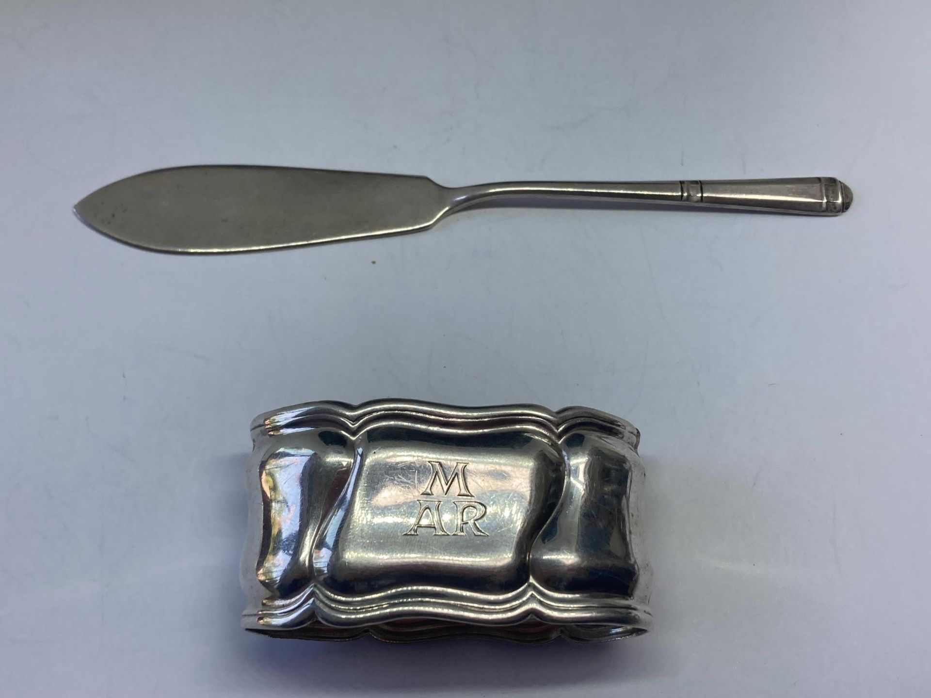 A SILVER NAPKIN RING AND KNIFE