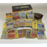 APPROXIMATELY 350 POKEMON CARDS IN A TRAINER BOX, HOLOS, GAME COUNTERS ETC