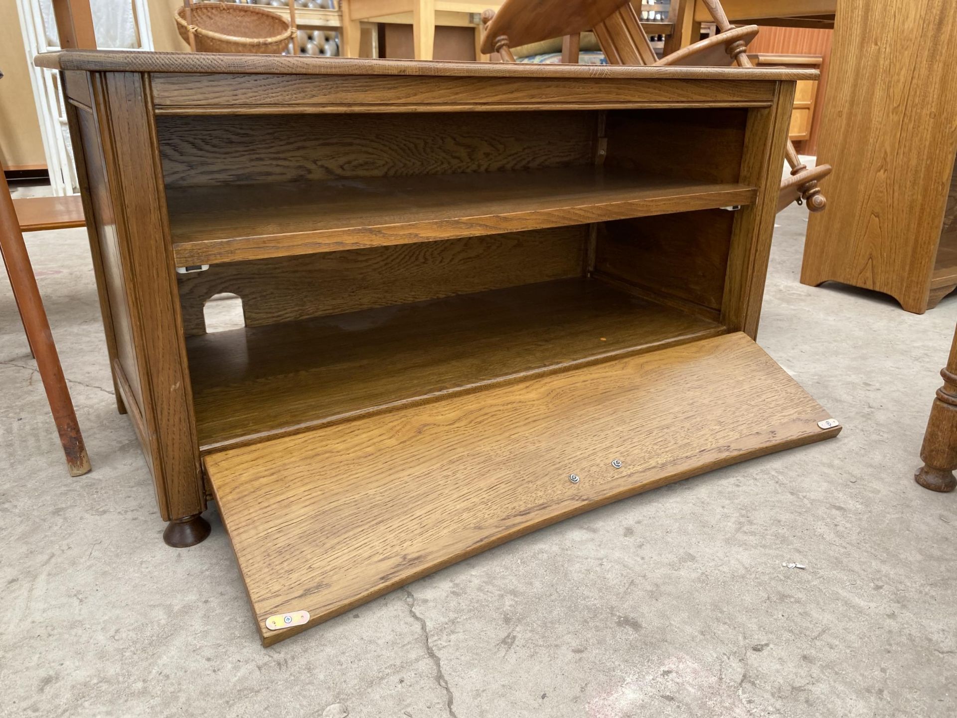 AN OAK TV STAND WITH DROP DOWN FRONT, 34" WIDE - Image 2 of 2