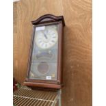 A WOODEN CASED WESTMINISTER CHIME QUARTZ WALL CLOCK