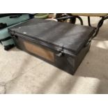 A LARGE METAL TRAVEL TRUNK